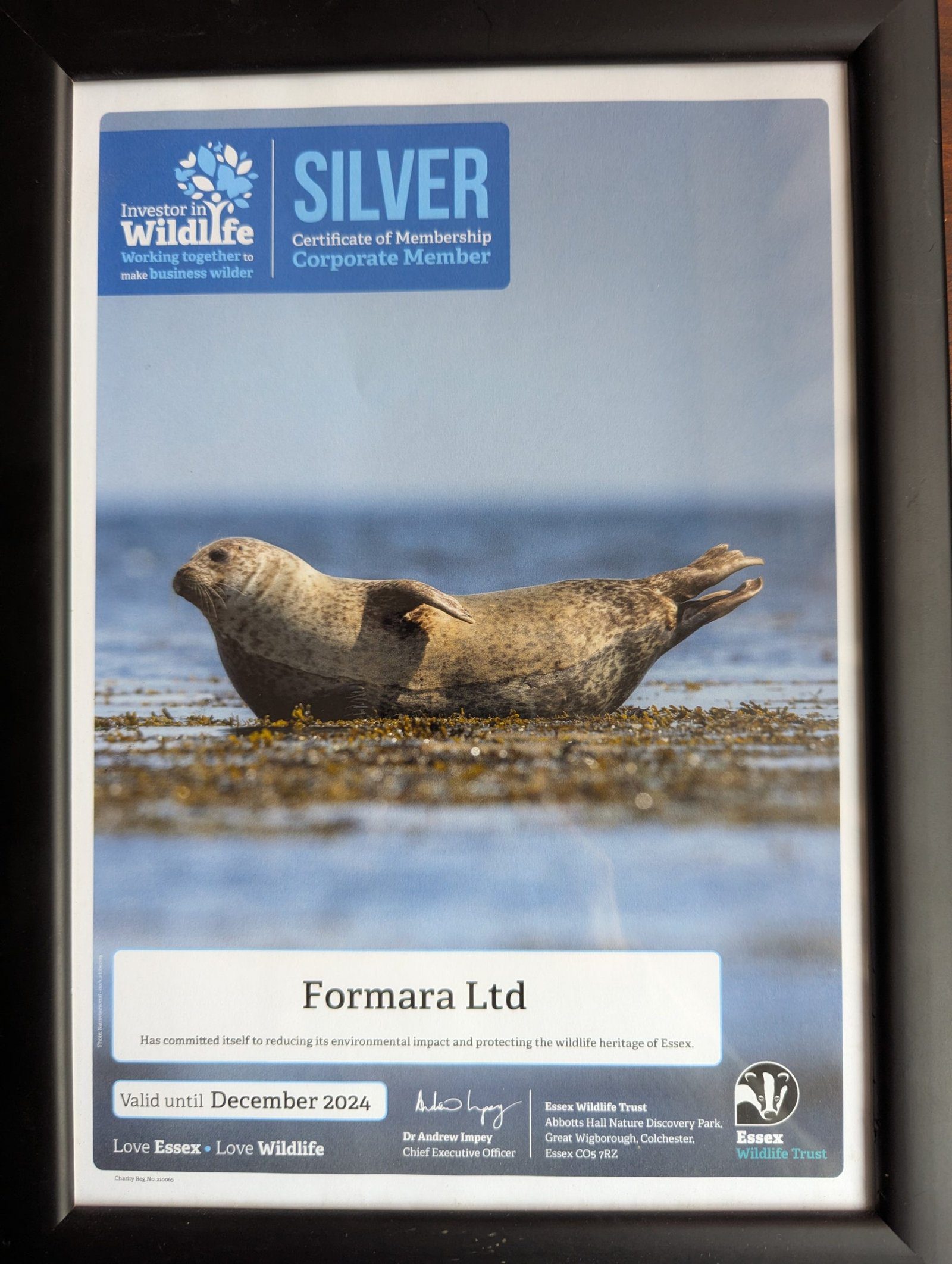 Essex Wildlife Trust membership certificate in a photo frame.